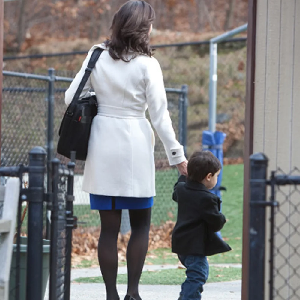 A child being dropped off at Red Balloon Child Care Center daycare by his mother