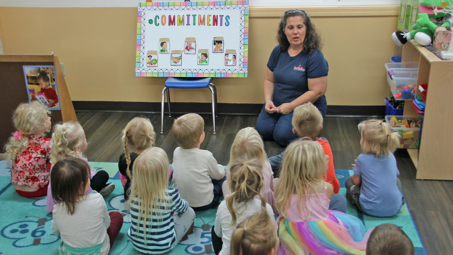 A teacher speaking to a classroom about commitments at a daycare in Becker, MN